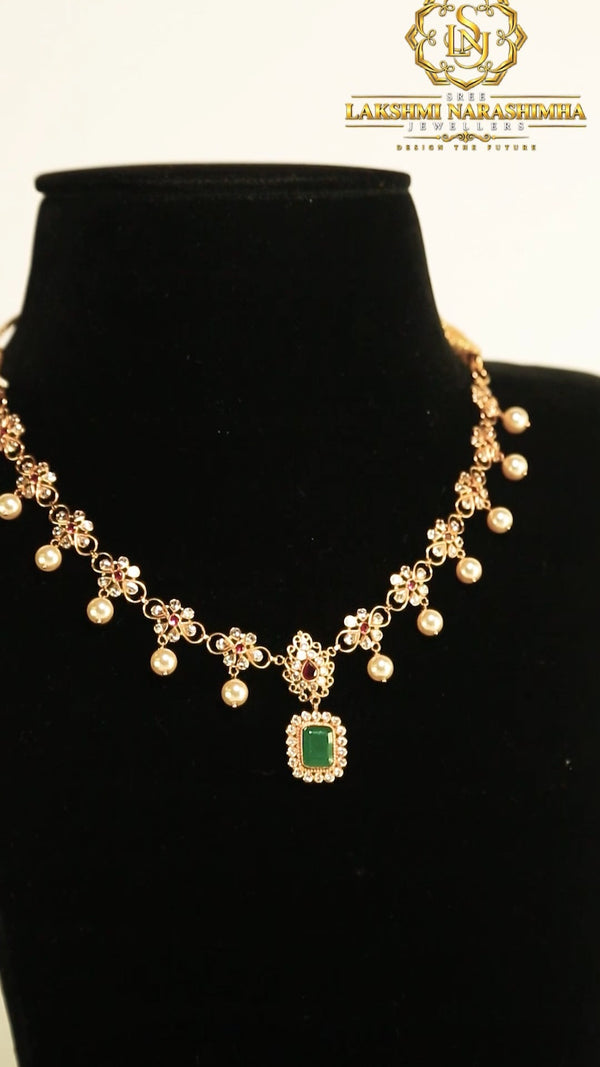 Gold necklace with green stone pendant